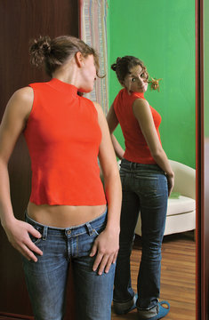 girl looking at a mirror