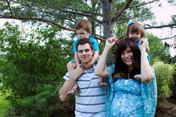 Fototapeta premium family of four in park