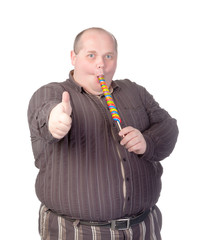 Fat man enjoying a lollipop