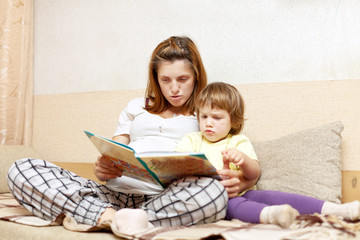 Mother and daughter reading  book