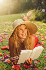 Young Woman Reading Book Outside