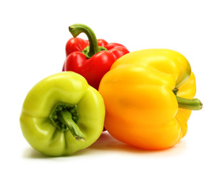 fresh yellow, red and green bell peppers isolated on white