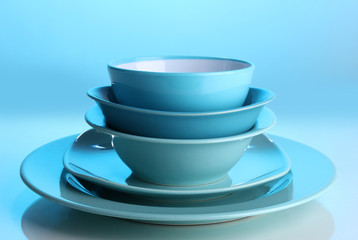 Blue tableware on blue background