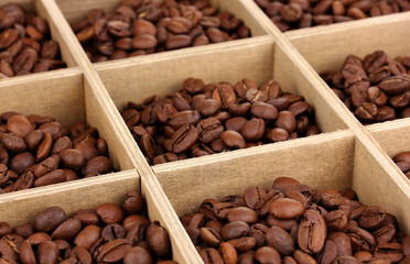 Coffee beans in wooden box close-up