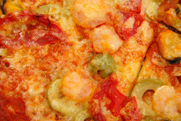 tasty pizza with shrimps and mussels close-up