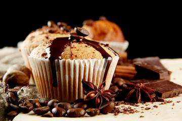 tasty muffin cakes with chocolate, spices and coffee seeds,