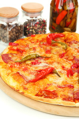 Tasty pepperoni pizza with vegetables on wooden board close-up