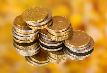 euro coins on color background