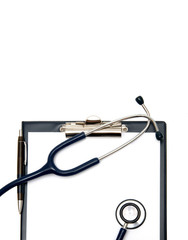 Empty document in a clipboard with medical equipment