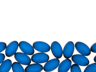 Blue pills background (pills isolated on white)