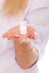 Woman hand holding pills