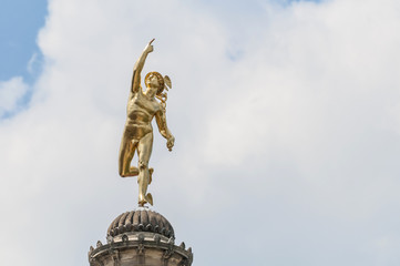 Fototapeta premium Mercury statue at Schlossplatz, Germany