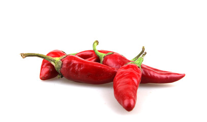 Red chilli peppers on white background.