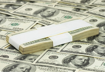 ten thousand dollars lying on banknotes