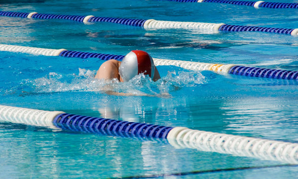 Breaststroke swimmer in outdoor swim meet