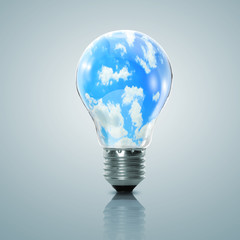 Electric light bulb and blue sky inside it