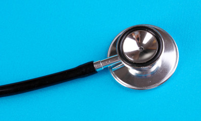 Stethoscope close-up on blue background