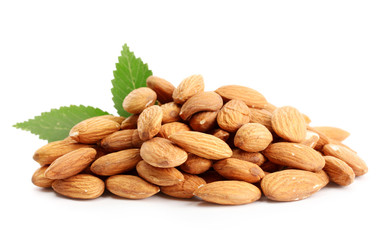 tasty almonds nuts with leaves, isolated on white