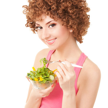 fun woman eating the salad on the white background