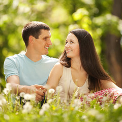 Young happy couple in the park