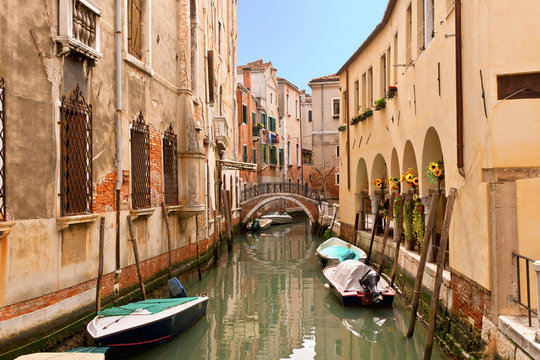 The narrow street - channel in Venice
