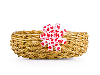 Basket for gifts with a white-red bow on the white