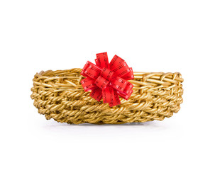 Fototapeta na wymiar Basket for gifts with a red bow on the white