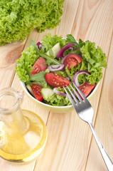Fresh salad with cucumbers tomatoes and onions
