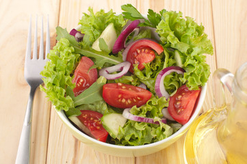 Fresh salad with cucumbers tomatoes and onions