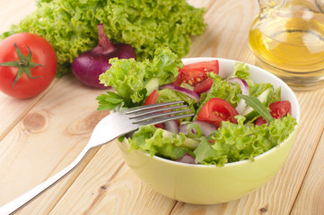 Fresh salad with cucumbers tomatoes and onions