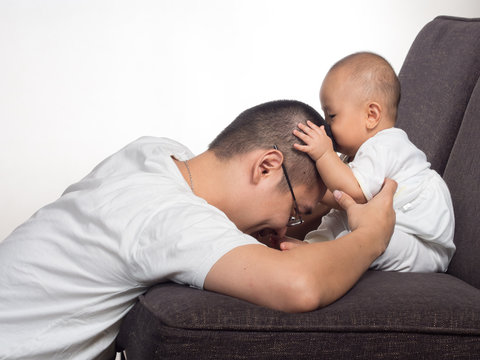 Baby Kissing Father