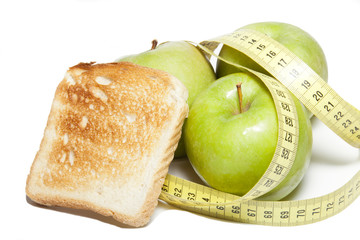 Apple with a tape measure and toast