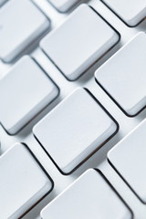 Close up of white keyboard with blank keys, copyspace