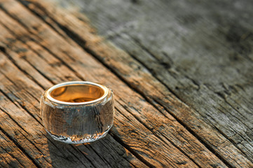 Crystal ring over old wood surface