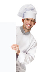 Looking out of the cardboard sheet chef cook in uniform