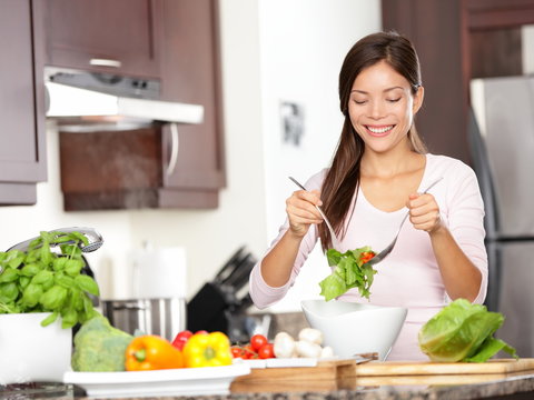 Woman making salad