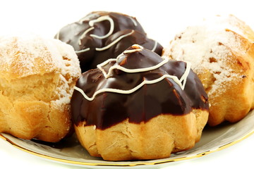 Cakes eclairs closeup.