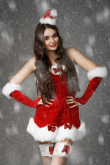 Beautiful girl wearing santa claus clothes. Christmas concept