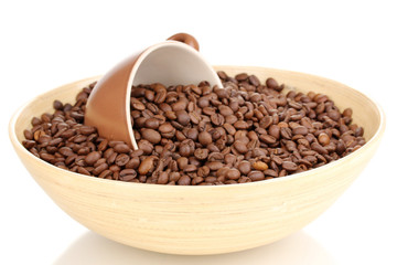 Coffee beans in bamboo bowl with cup isolated on white