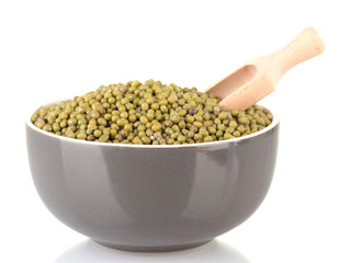 Green mung beans  with scoop in bowl isolated on white