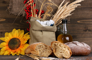 Rye bread on wooden table on wooden background