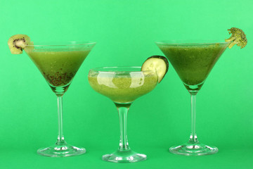 Three kinds of green juice in coctail glasses