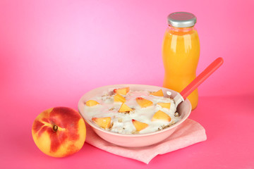 tasty dieting food and bottle of juice, on pink background