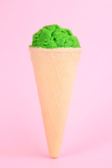 Scoop of the kiwi ice cream in the waffle cone