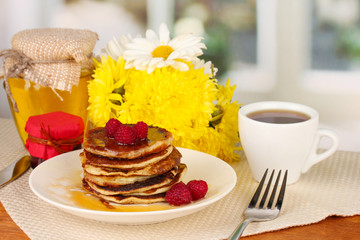 delicious sweet pancakes on bright background