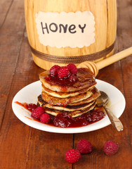 delicious sweet pancakes on wooden background