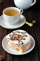Biscuit roll with the cream in white chocolate