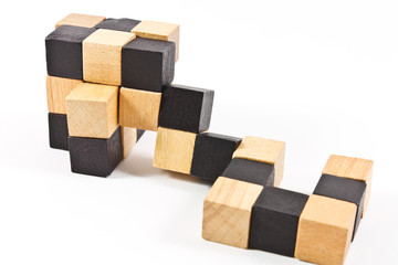 Puzzle in form of wooden blocks on a white background