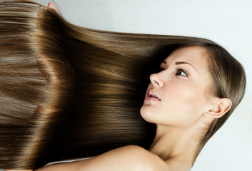  beautiful young woman with elegant long shiny hair , hairstyle