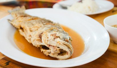 Crispy fried Whole fish in white dish